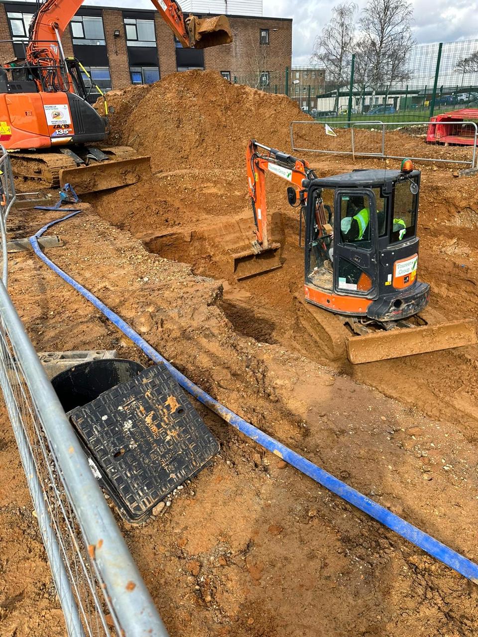 Thane Construction team following safety protocols during residential building work in London
